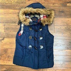 Navy Blue toggle Puffer Vest with faux fur hood lining, sized medium.